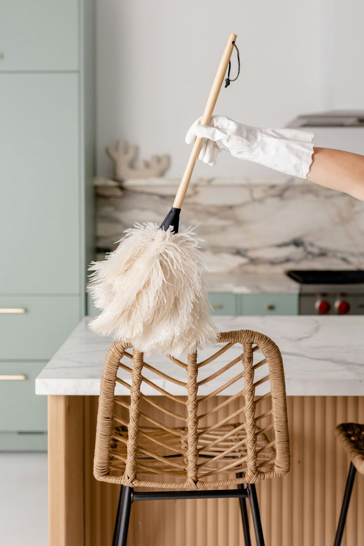 Dusting an upscale kitchen for a vacation rental turnover - Good Taste Cleaning Services